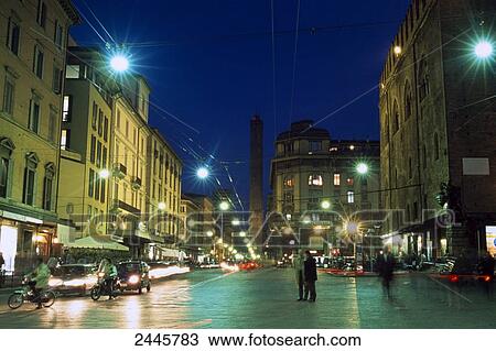 People at street lit up at night View Large Photo Image Stock Image - People at street lit up at night . Fotosearch