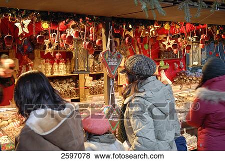 Stock Photo - People shopping during Christmas . Fotosearch