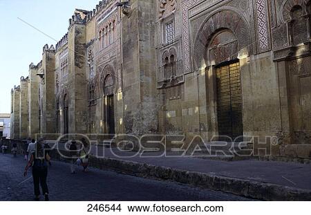 People walking in front of mosque, Mezquita Catedral de Cordoba, Cordoba, Andalusia, Spain View Large Photo Image Picture - People walking in front of mosque, Mezquita Catedral de Cordoba, Cordoba, Andalusia, Spain . Fotosearch