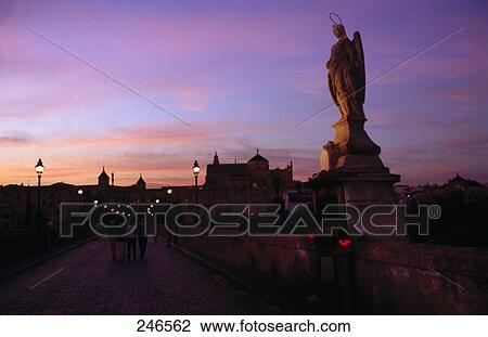 People walking on bridge at dusk, Puente Romano, Guadalquivir River, Mezquita Catedral de Cordoba, Cordoba, Andalusia, Spain View Large Photo Image Stock Image - People walking on bridge at dusk, Puente Romano, Guadalquivir River, Mezquita Catedral de Cordoba, Cordoba, Andalusia, Spain . Fotosearch