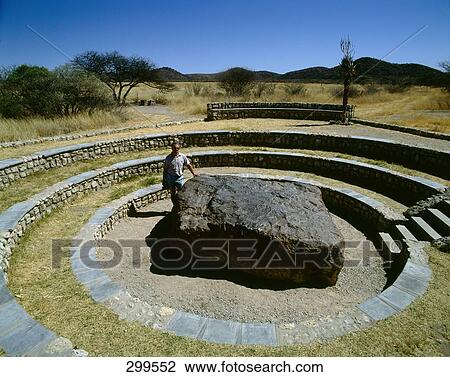 Person standing near meteorite in park, Grootfontein, Namibia View Large Photo Image Stock Image - Person standing near meteorite in park, Grootfontein, Namibia . Fotosearch