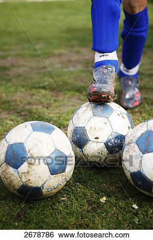 person with several footballs, close-up View Large Photo Image Stock Photograph - person with several footballs, close-up . Fotosearch