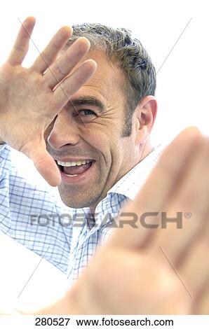 Portrait of a mature man gesturing with his hands View Large Photo Image Stock Photo - Portrait of a mature man gesturing with his hands . Fotosearch