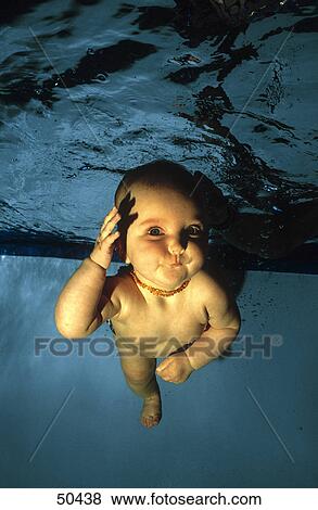 Portrait of baby boy swimming underwater View Large Photo Image Stock Photo - Portrait of baby boy swimming underwater . Fotosearch