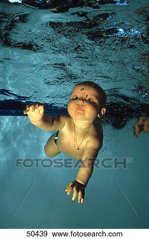 Portrait of baby boy swimming underwater View Large Photo Image Stock Photo - Portrait of baby boy swimming underwater . Fotosearch