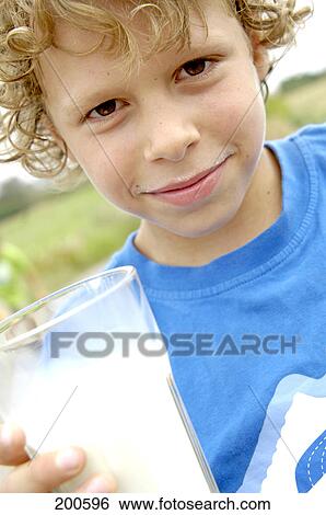 Portrait of boy drinking milk View Large Photo Image Stock Photograph - Portrait of boy drinking milk . Fotosearch