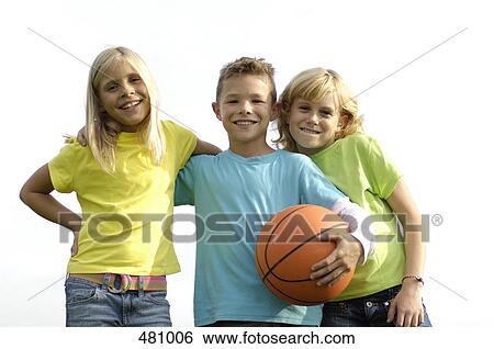 Stock Photograph - Portrait of brother and sisters smiling . Fotosearch