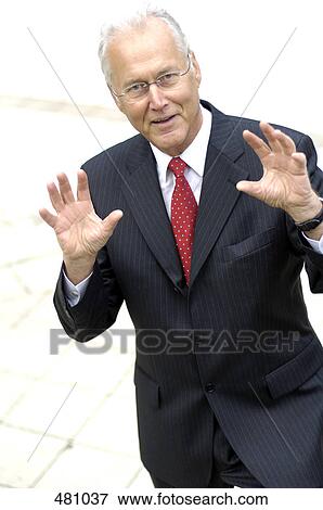 Stock Photo - Portrait of businessman gesturing with hands . Fotosearch