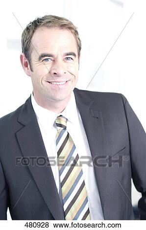 Stock Photo - Portrait of businessman smiling . Fotosearch
