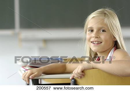 Portrait of girl smiling in classroom View Large Photo Image Stock Photo - Portrait of girl smiling in classroom . Fotosearch