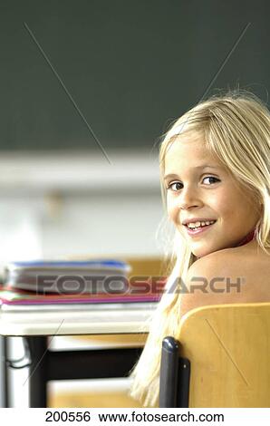Portrait of girl smiling in classroom View Large Photo Image Stock Photograph - Portrait of girl smiling in classroom . Fotosearch