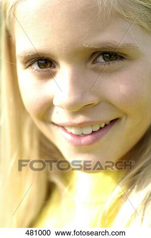 Stock Image - Portrait of girl smiling . Fotosearch