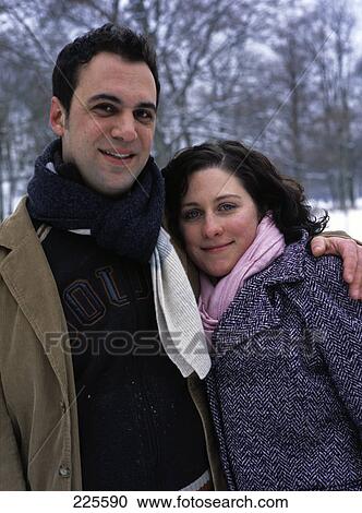 Stock Image - Portrait of mid adult couple smiling . Fotosearch