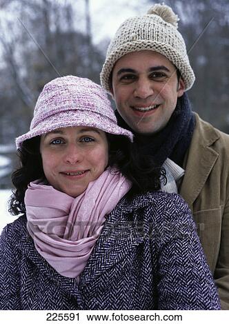 Stock Image - Portrait of mid adult couple smiling . Fotosearch