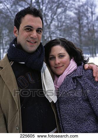Stock Photography - Portrait of mid adult couple smiling . Fotosearch