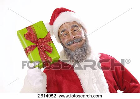 Portrait of senior man in santa costume showing Christmas gift View Large Photo Image Stock Image - Portrait of senior man in santa costume showing Christmas gift . Fotosearch