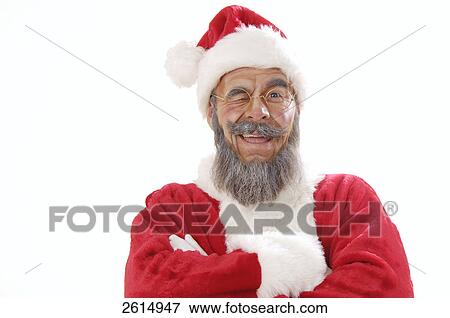 Stock Photo - Portrait of senior man in santa costume winking . Fotosearch