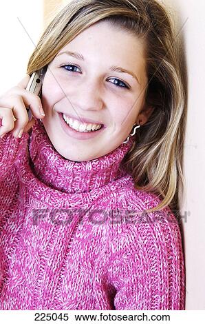 Portrait of teenage girl talking on mobile phone and smiling View Large Photo Image Stock Photography - Portrait of teenage girl talking on mobile phone and smiling . Fotosearch