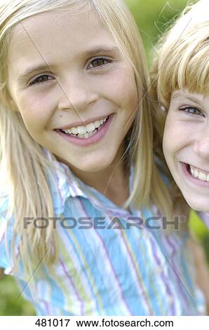Portrait of two girls smiling View Large Photo Image Stock Photo - Portrait of two girls smiling . Fotosearch