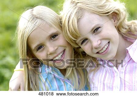 Portrait of two girls smiling View Large Photo Image Stock Photo - Portrait of two girls smiling . Fotosearch