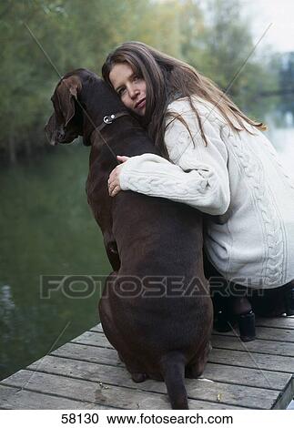 Stock Image - Portrait of woman with dog . Fotosearch