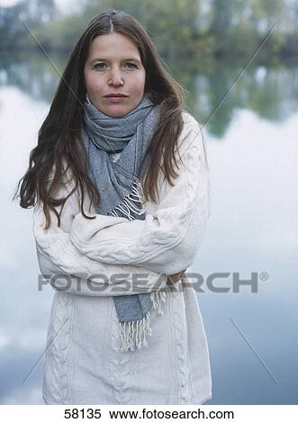 Portrait of young woman shivering View Large Photo Image Stock Photography - Portrait of young woman shivering . Fotosearch