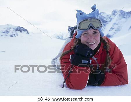 Portrait of young woman smiling in ski wear on snow View Large Photo Image Stock Photography - Portrait of young woman smiling in ski wear on snow . Fotosearch