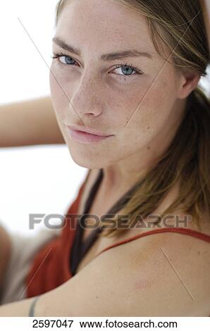 Stock Photo - Portrait of young woman smiling . Fotosearch