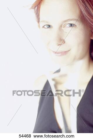 Portrait of young woman smiling View Large Photo Image Stock Photo - Portrait of young woman smiling . Fotosearch