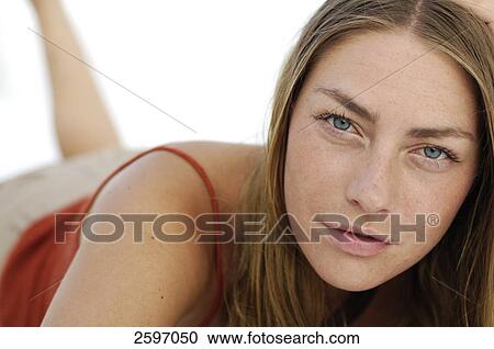 Portrait of young woman thinking View Large Photo Image Stock Image - Portrait of young woman thinking . Fotosearch