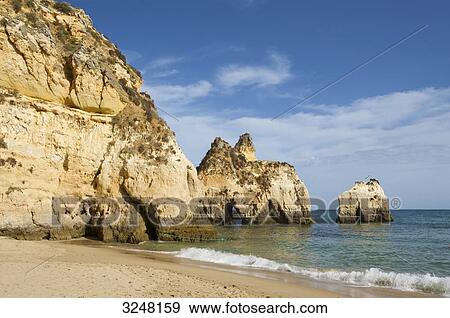 Stock Photo - Praia dos Tres Irmaos, Algarve, Portugal . Fotosearch