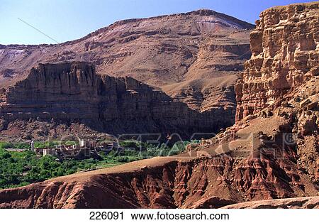 Stock Image - Rock formations on arid landscape, Morocco . Fotosearch