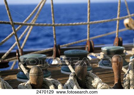 Row of rope pulleys on sailboat deck View Large Photo Image Stock Photo - Row of rope pulleys on sailboat deck . Fotosearch