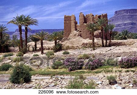 Stock Photograph - Ruins on arid landscape, Atlas Mountains, Draa Valley, Morocco . Fotosearch