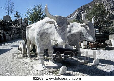 Stock Photo - Sculpture of ox cart in town, Carrara, Tuscany, Italy . Fotosearch