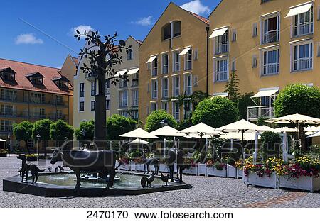 Stock Image - Sculptures at fountain in street, Bad Griesbach, Passau, Bavaria, Germany . Fotosearch