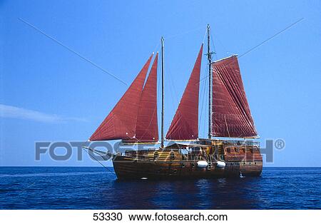 Stock Image - Ship in sea against blue sky, Maldives . Fotosearch
