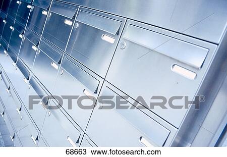 Stock Image - Side profile of mailboxes in rows . Fotosearch