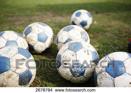 Picture - Soccer ball in field . Fotosearch