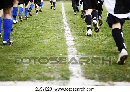 Stock Photo - Soccer players in soccer field . Fotosearch