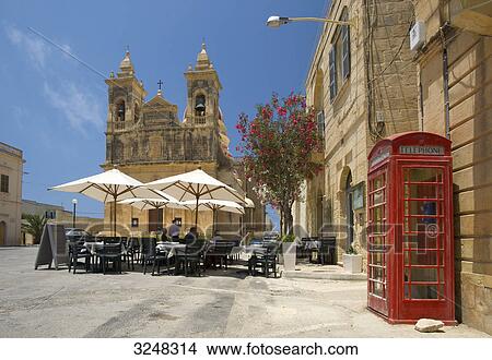 Street cafe and cathedral, San Lawrenz, Gozo, Malta View Large Photo Image Picture - Street cafe and cathedral, San Lawrenz, Gozo, Malta . Fotosearch