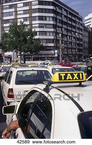 Taxi on road, Frankfurt, Germany View Large Photo Image Stock Photo - Taxi on road, Frankfurt, Germany . Fotosearch