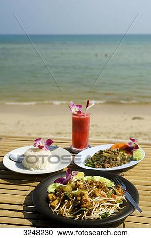 Thai-Food and Cocktail, Lamai Beach, Ko Samui, Thailand View Large Photo Image Stock Image - Thai-Food and Cocktail, Lamai Beach, Ko Samui, Thailand . Fotosearch