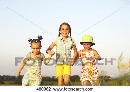Three girls running View Large Photo Image Stock Image - Three girls running . Fotosearch