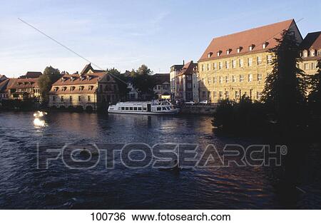 Stock Photograph - Tour boat at harbor, River Regnitz, Bamberg, Bavaria, Germany . Fotosearch