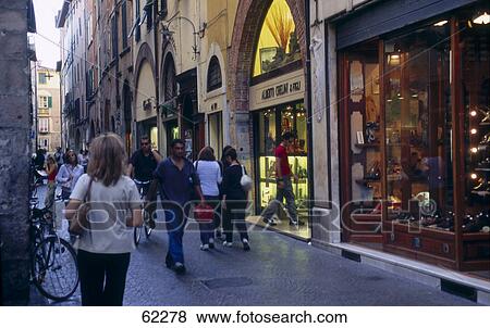 Tourists at market, old part of town, Lucca, Tuscany, Italy View Large Photo Image Stock Photo - Tourists at market, old part of town, Lucca, Tuscany, Italy . Fotosearch