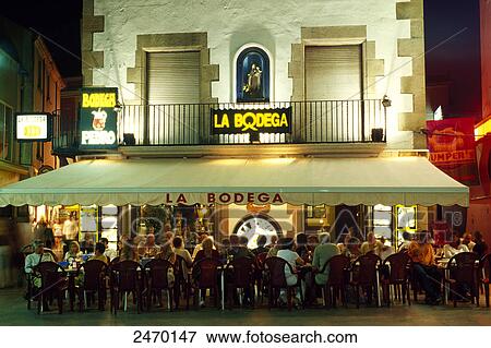 Tourists at sidewalk cafe, Spain View Large Photo Image Stock Photo - Tourists at sidewalk cafe, Spain . Fotosearch