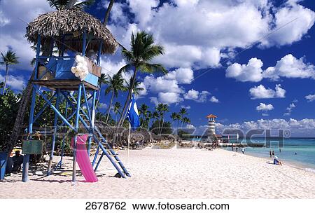 Stock Image - Tourists on beach, Bayahibe, Hispaniola, Dominican Republic . Fotosearch