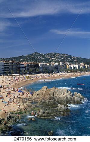 Tourists on beach, Lloret de Mar, Girona Province, Catalonia, Spain View Large Photo Image Stock Photograph - Tourists on beach, Lloret de Mar, Girona Province, Catalonia, Spain . Fotosearch