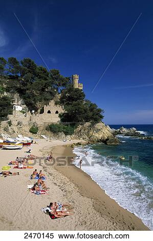 Tourists on beach, Lloret de Mar, Girona Province, Catalonia, Spain View Large Photo Image Stock Photography - Tourists on beach, Lloret de Mar, Girona Province, Catalonia, Spain . Fotosearch